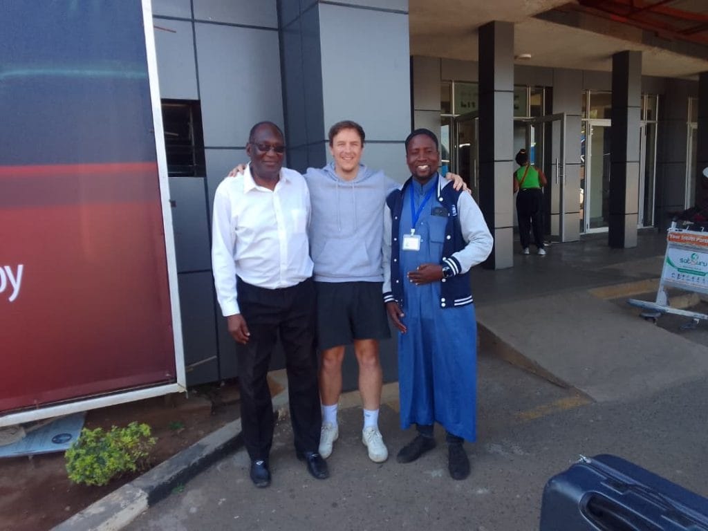 Adam welcomed by school partners on arrival in Malawi